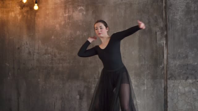 woman-is-engaged-in-ballet-in-a-modern-performance-she-rehearses-the-performance