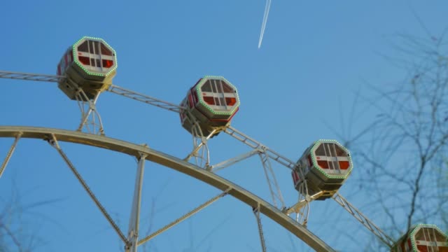 Close-Up-of-a-Ferris-Wheel-Carousel-and-Airplane