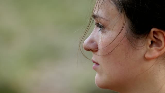Sad-Depressed-young-Woman's-Profile-Crying--Outdoor
