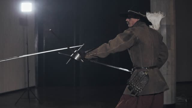 Medieval-warriors-are-fighting-during-sword-battle-indoors-in-slow-motion