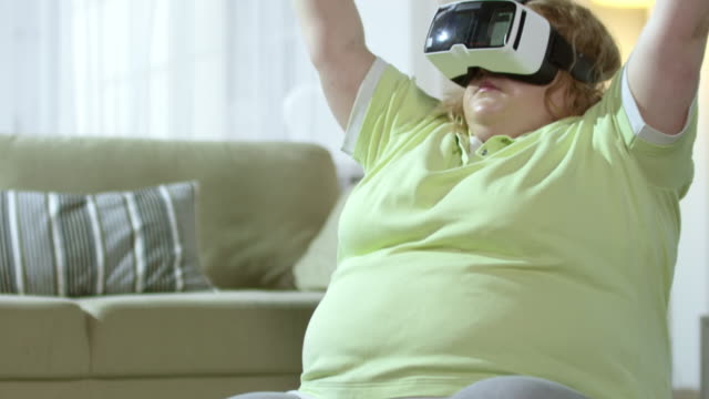 Chubby-Woman-Doing-Yoga-in-VR-Goggles