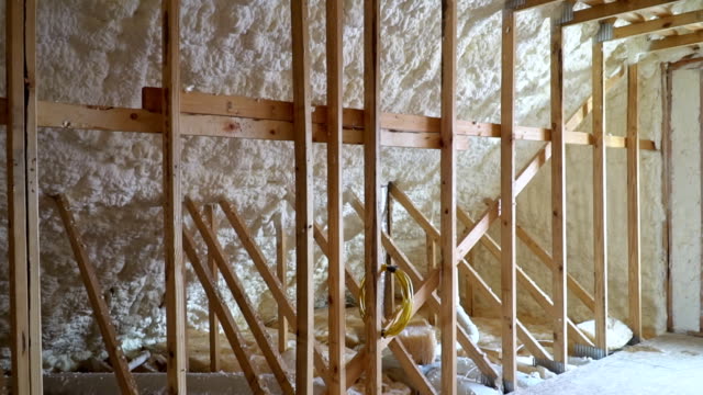 New-home-construction-with-installation-of-termal-insulation-installing-at-the-attic-the-roof