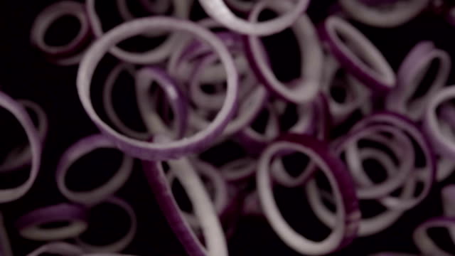 Falling-of-sliced-red-onion.-Slow-motion-480-fps