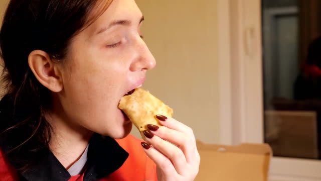 woman-enjoy-eating-pizza-at-home