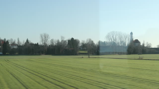 Landscape-passing-seen-through-train-window