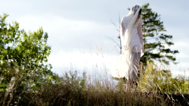 Woman-with-make-up-of-dead-bride-for-Halloween-dressed-in-white-wedding-gown.-4K