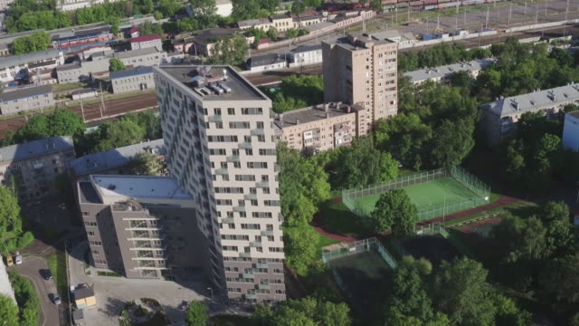 Drone-footage-of-modern-large-apartment-building.-Development-infrastructure-city-for-big-population,-modern-skyscrapers-and-tall-edifices-of-megapolis,-urban-transportation-system.