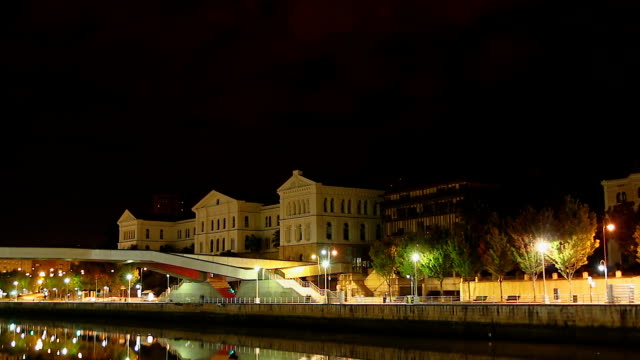 Night-view-of-main-building-of-University-of-Deusto,-Bilbao,-Spain,-time-lapse