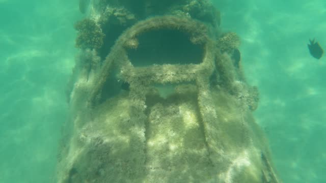 UNDERWATER:-Summer-sunrays-shine-on-cockpit-of-destroyed-military-airplane.