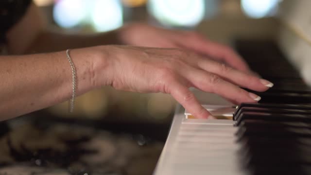 Female-playing-piano