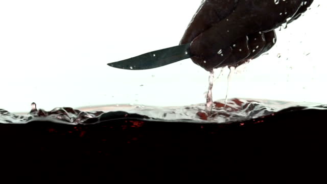 Brutal-murderer-washing-bloody-knife,-cleaning-weapon-from-fingerprints,-crime