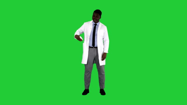 Afro-american-doctor-presenting-nasal-spray-on-a-Green-Screen,-Chroma-Key