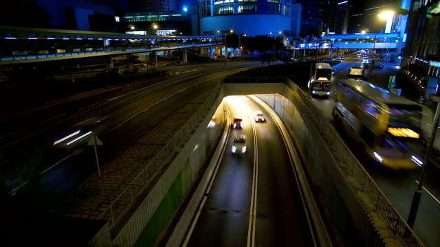 Cityscape-timelapse-at-night-busy-traffic-In-downtown.