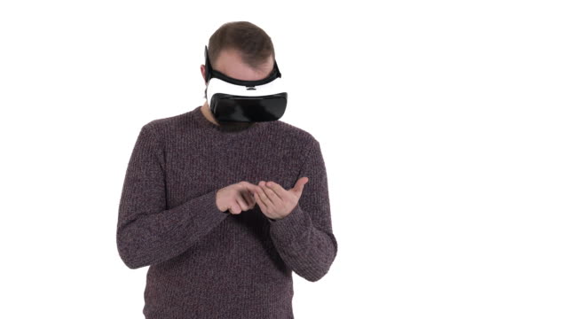 Man-imitates-smartphone-using-while-wearing-VR-glasses.-Digital-age-and-new-technologies