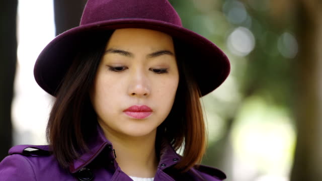 pensive-lonely-sophisticated-asian-woman-thinking,-close-up