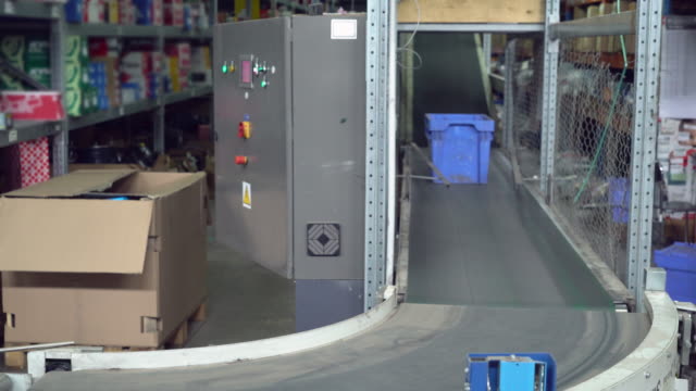 blue-container-moving-on-conveyor