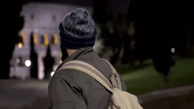 Homeless-stand-up-and--walking-in-the-city-park-at-night