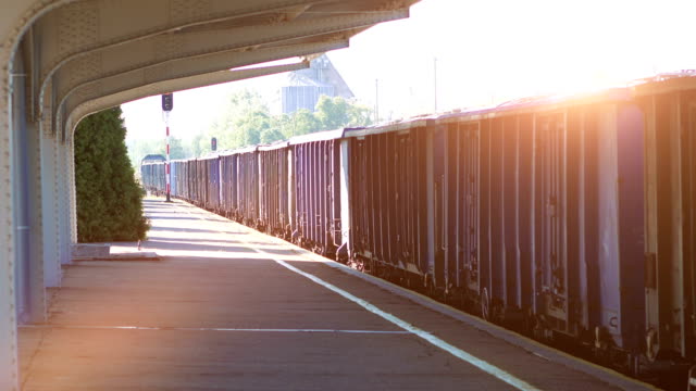 Cargo-train-moving-through-the-train-station-in-4k-slow-motion