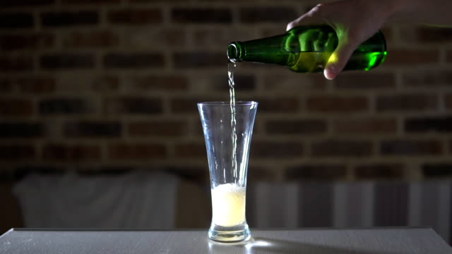 Pouring-beer-into-a-glass-on-the-bar