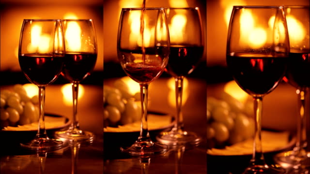 Vertical-videos-of-two-red-wine-wineglasses-over-fireplace-background.