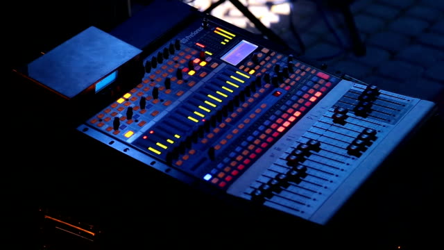 Audio-mixer-working-on-rock-concert