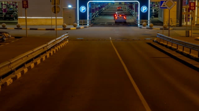 cars-in-queue-at-entrance-in-underground-parking-of-hypermarket-time-lapse