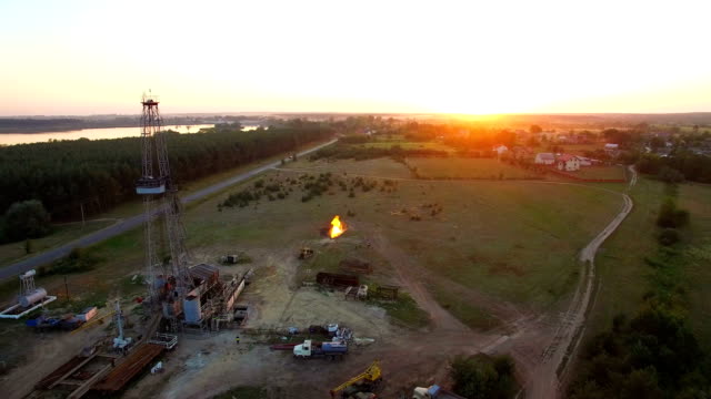 Aerial-shooting-Flaring-of-high-pressure-gas-from-the-gas-well-at-sunset.
