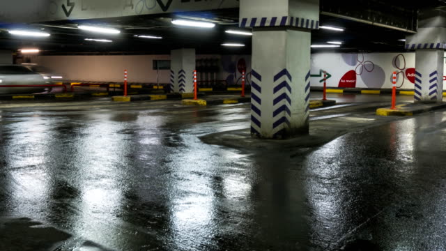 motion-of-cars-at-entrance-and-exit-in-underground-shopping-mall-parking--time-lapse