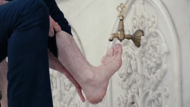 Slow-motion-footage.-Washing-of-the-Feet-before-prayer