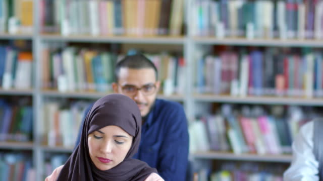 Muslim-Woman-in-Hijab-Listening-to-Lecture-at-College