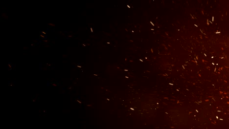 Burning-Hot-Sparks-Rising-from-Large-Fire-in-Night-Sky.-Side-Movement.-Abstract-Isolated-Fire-Glowing-Particles-on-Black-Background-Slow-Motion.-Looped-3d-Animation.