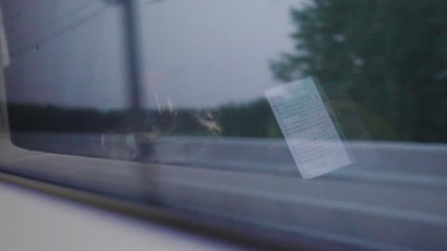 Cell-Phone-Reflection-in-Train-Window-Traveling-Commuting