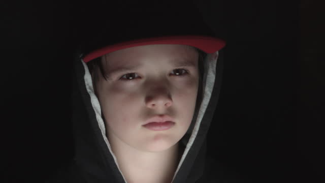 4k-Face-Portrait-of-Boy-Child-Posing-Serious-and-Sad