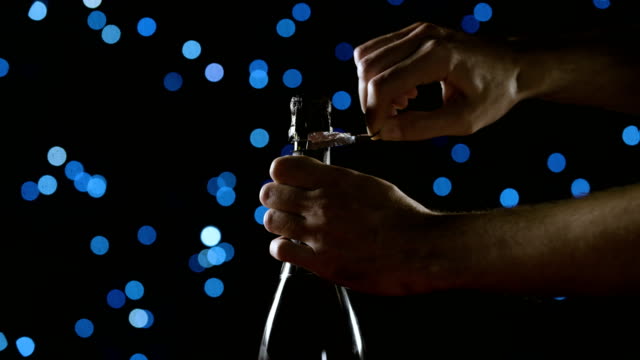 Opening-a-champagne-bottle