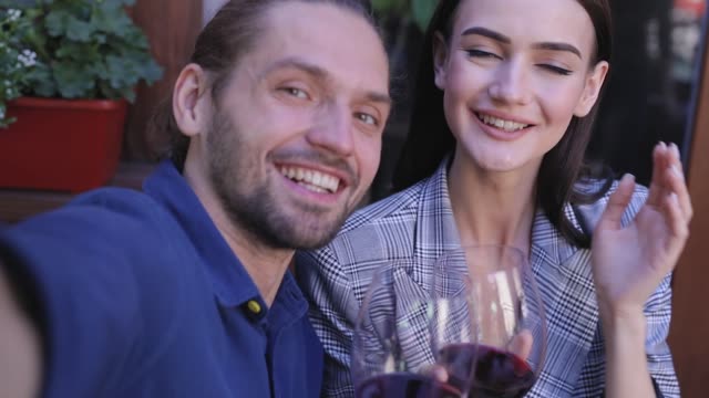 Happy-Couple-With-Wine-Taking-Photos-Camera-View