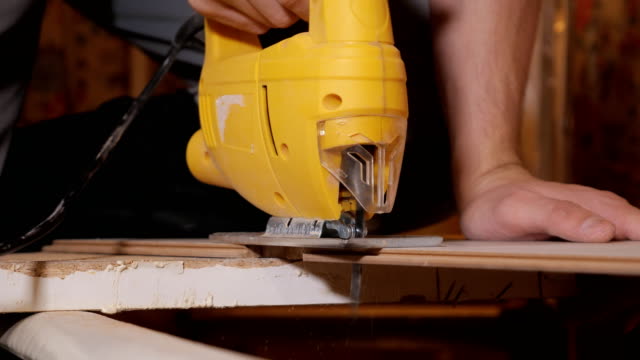 Man-working-with-jig-saw