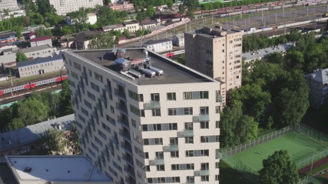 Drone-footage-of-exterior-apartment-building.-Development-infrastructure-city-for-big-population,-modern-skyscrapers-and-tall-edifices-of-megapolis,-urban-transportation-system.
