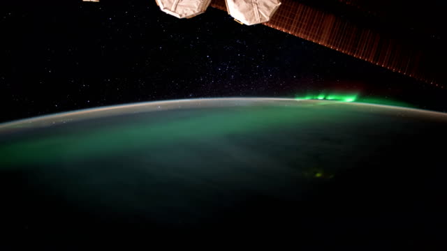 Earth-and-Aurora-Borealis-from-ISS.-Elements-of-this-video-furnished-by-NASA.-8K-Timelapse