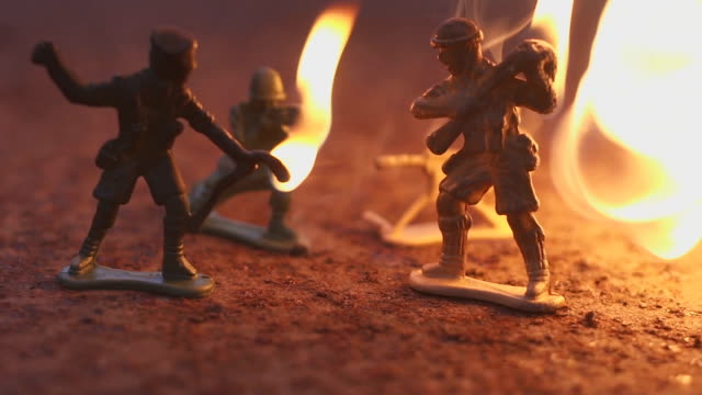 toy-soldier-in-the-fire.-The-model-of-the-battle-scene.-The-concept-of-the-death-of-war