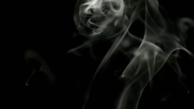 white-smoke-with-bright-scraps-on-black-isolated-background.-Great-for-overlay-in-a-video-editor