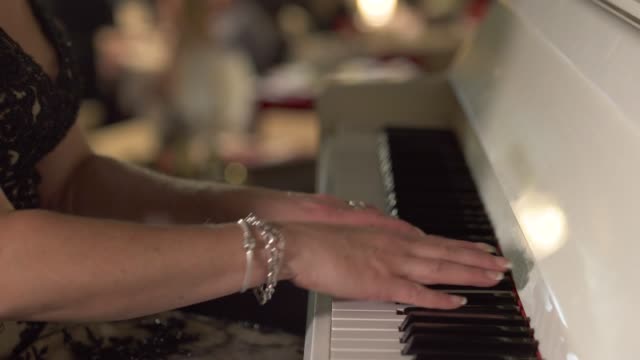 Adult-woman-plays-piano