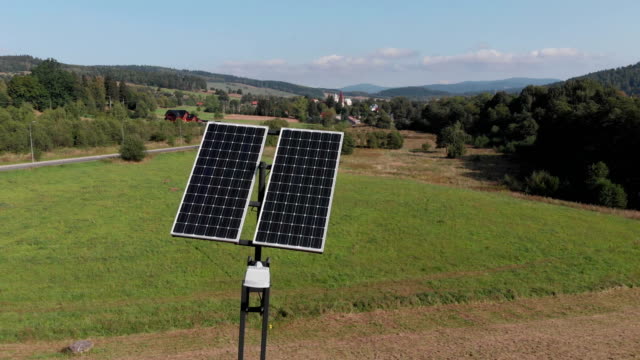 Green-power-generation-by-solar-panels.-Camera-slowly-rotating-around-solar-panels