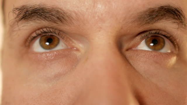 A-man-looks-up.-Close-up.-The-eyes-of-man.