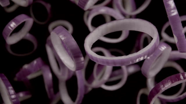 Falling-of-sliced-red-onion.-Slow-motion-240-fps