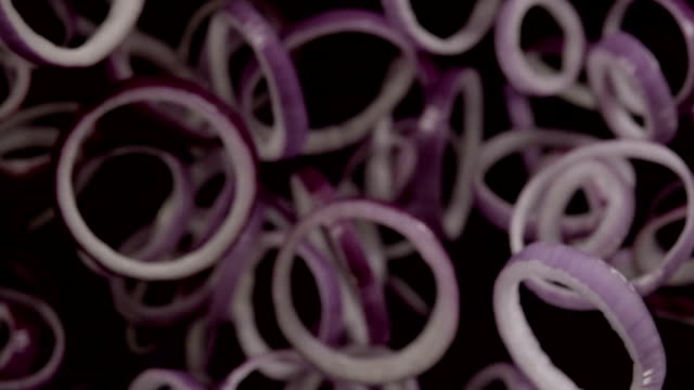 Falling-of-sliced-red-onion.-Slow-motion-480-fps