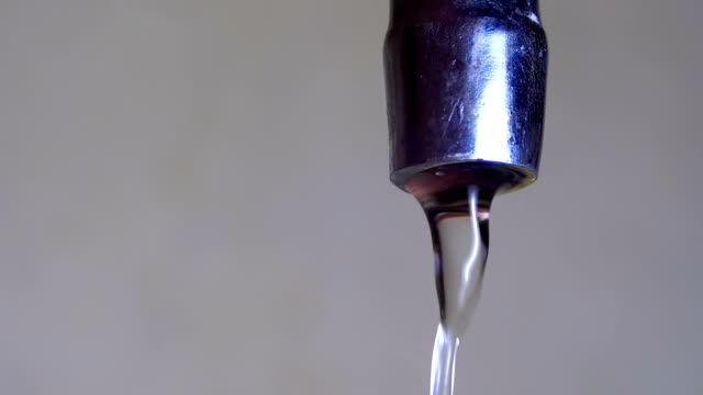 Water-Running-from-the-Tap-into-a-Sink.-Slow-Motion