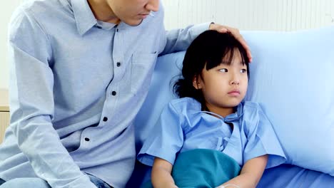 Little-girl-was-taking-care-by-her-father-at-hospital.-People-with-Healthcare-and-Medical-Concept.