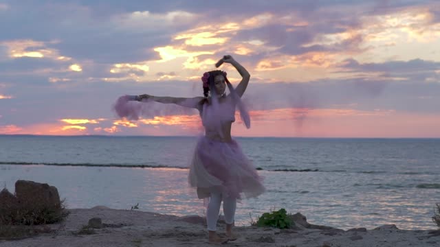 dancing,-dance,-belly,-women,-colorful,-pink,-caucasian,-movements,-carefree,-leisure,-outdoors,-clouds,-graceful,-shore,-make-up,-glitter,-lifestyle,-color,-dancer,-fashionable,-body-movements,-purple,-smoke,-slow-motion,-show,-young,-motion,-body,-elega