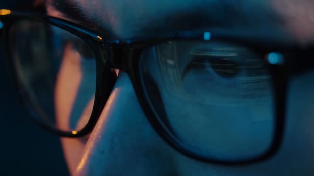 close-up-of-hacker-in-glasses-looking-at-screen