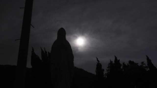 The-Virgin-Mary-at-Cemetery-with-the-moon-in-silhouette-scene